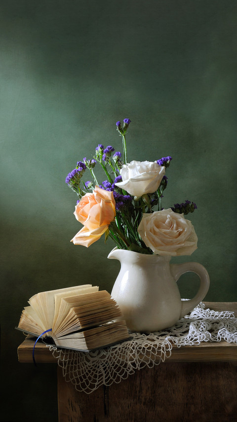 Romantic still life with a bouquet of roses and a book screenshot