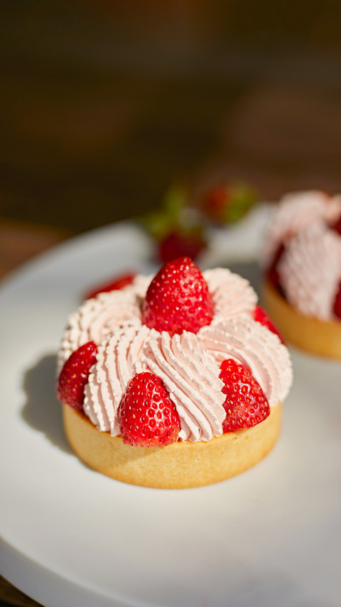 Close up strawberry tarts with cream sauce screenshot