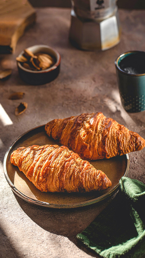 French croissant in the glare of the sun screenshot