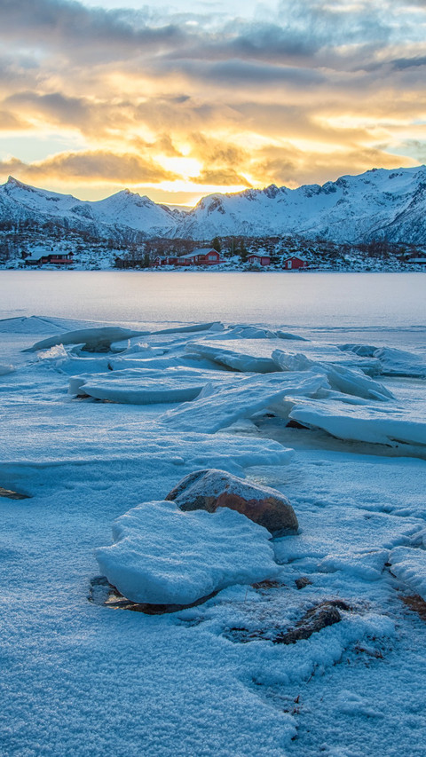 Breathtaking sunset over frozen lake like a painting. screenshot