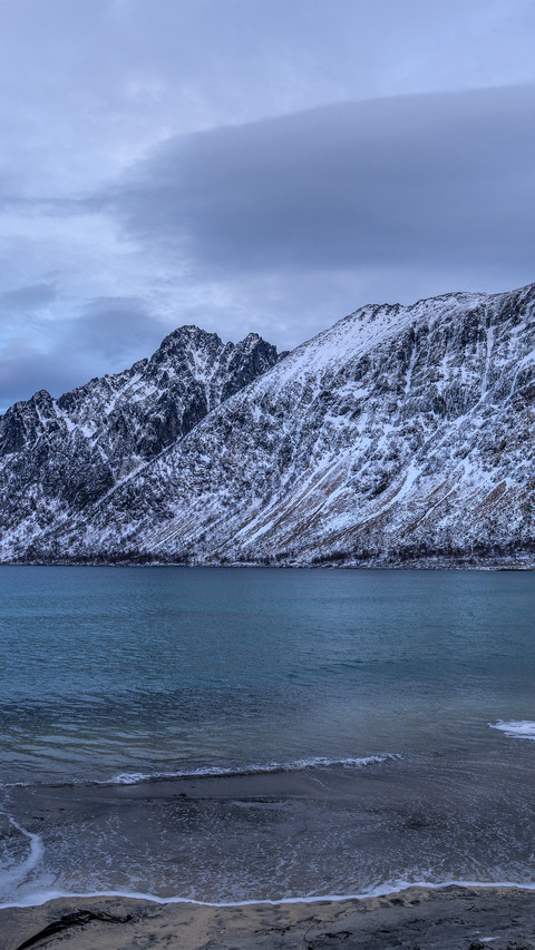 The blues of the sunrise over the snowcapped mountains screenshot