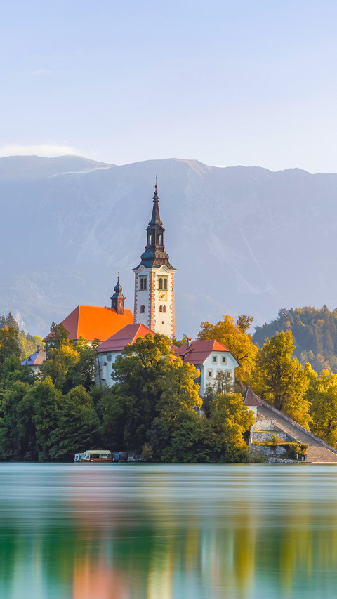 Nature scenery from Julien Alps with church near water screenshot