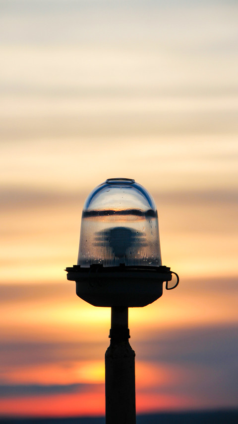 Warning light on a sunset background screenshot