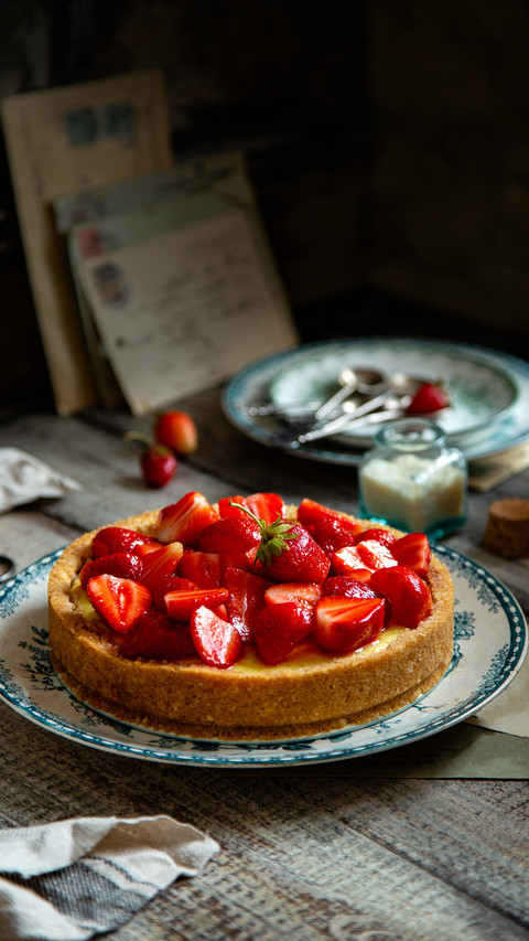 Homemade delicious strawberry tart or pieon vintage plate screenshot