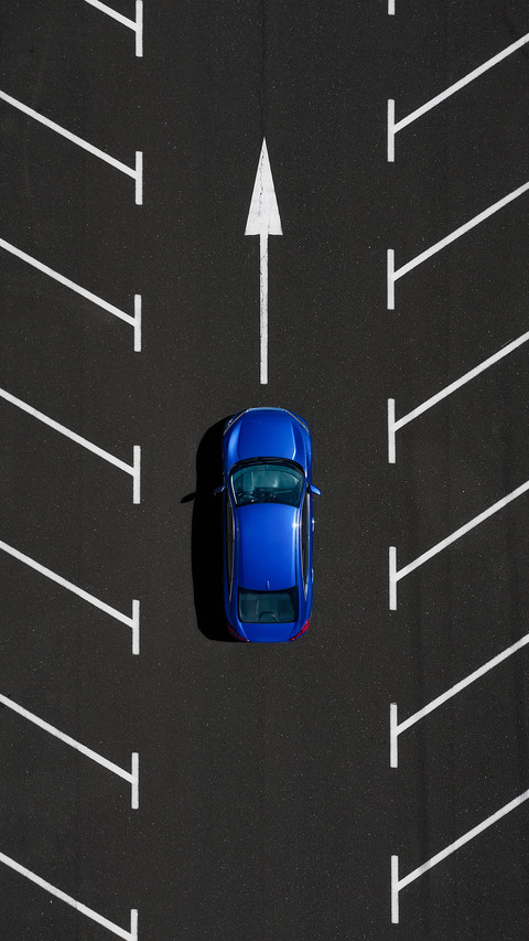 Car in an empty parking lot screenshot