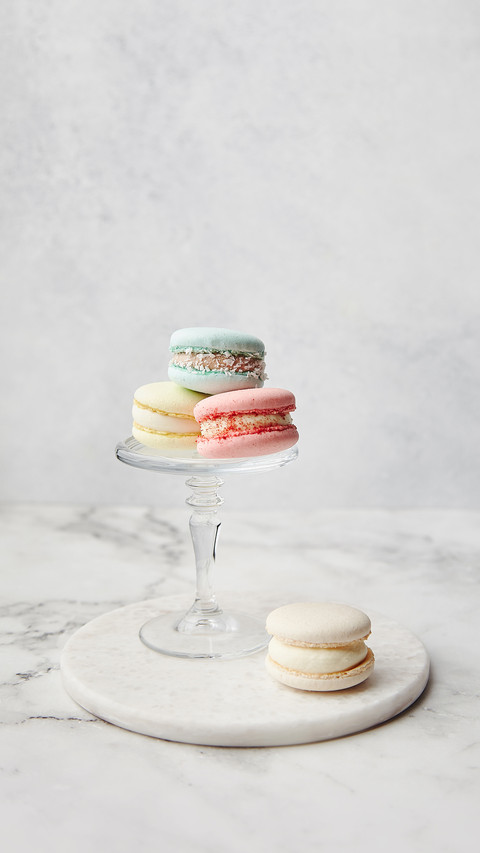 French cake macarons on a marble background screenshot