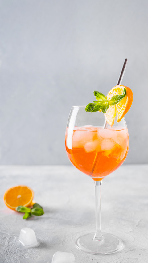 Classic Italian aperol spritz cocktail in wine glass screenshot