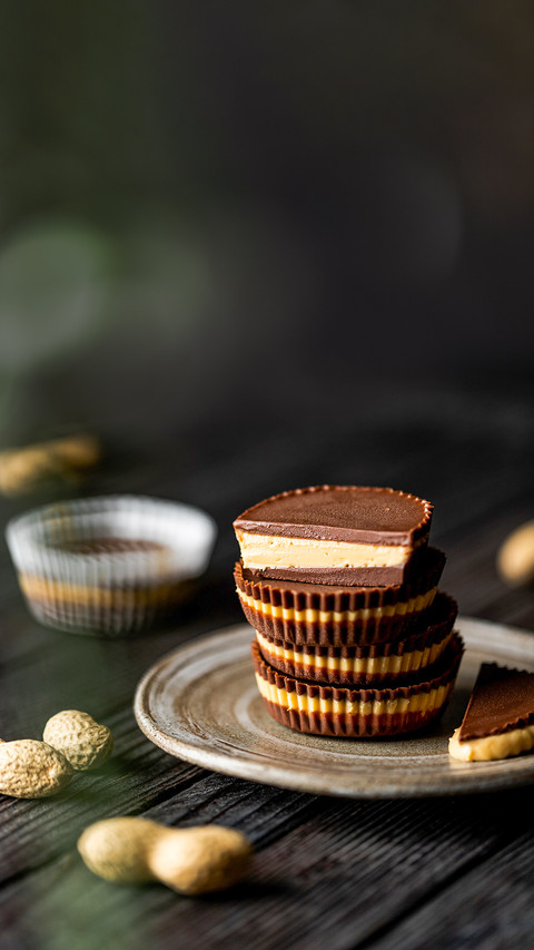 Healthy peanut butter cups tower moody food photography screenshot