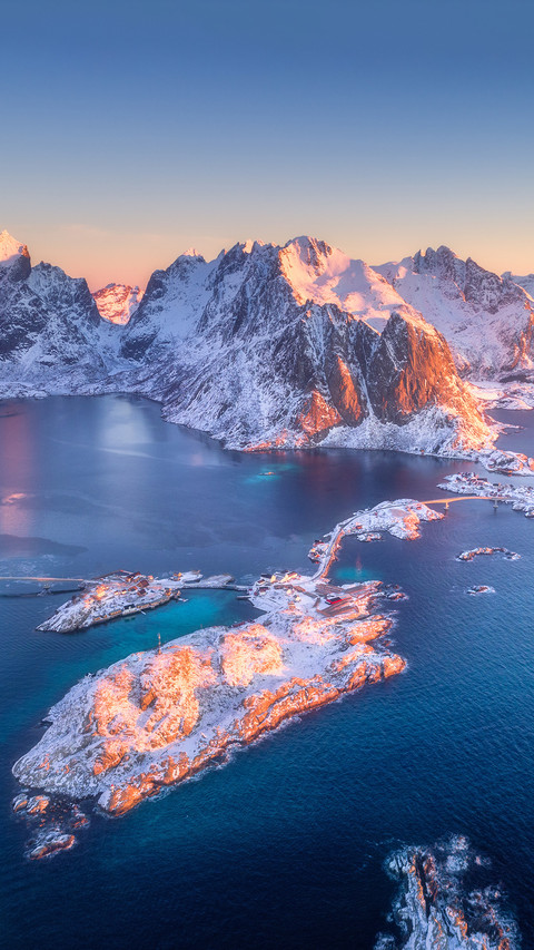 Aerial Photography of Snowy Mountains And Sea screenshot