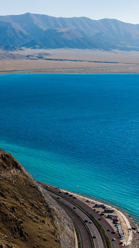 Sayram lake and the mountain ridge line screenshot
