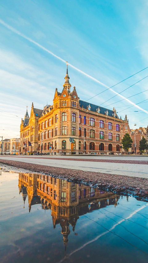 Historic building in Amsterdam centre under sunset light screenshot