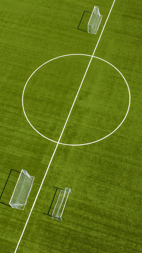 Close up of the midfield circle in an empty football field screenshot