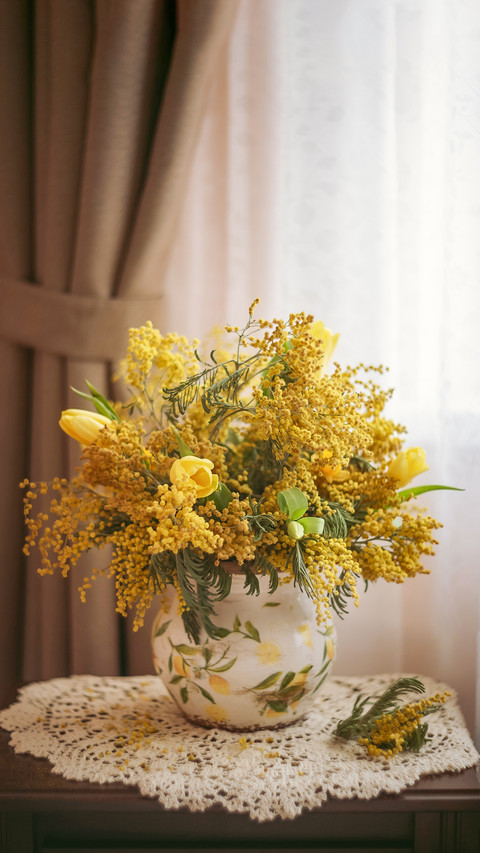 Photo of a bouquet of yellow mimosa and tulips by the window screenshot