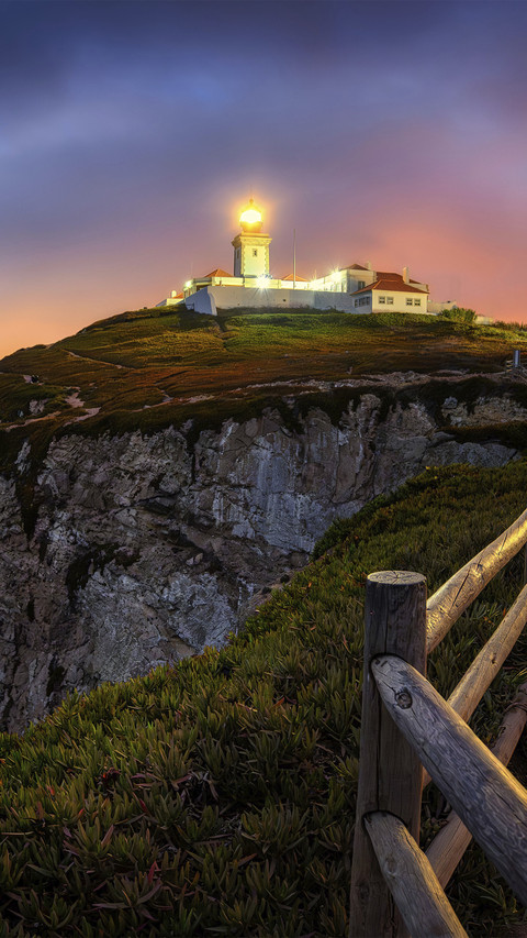 The lighthouse lights up at night screenshot