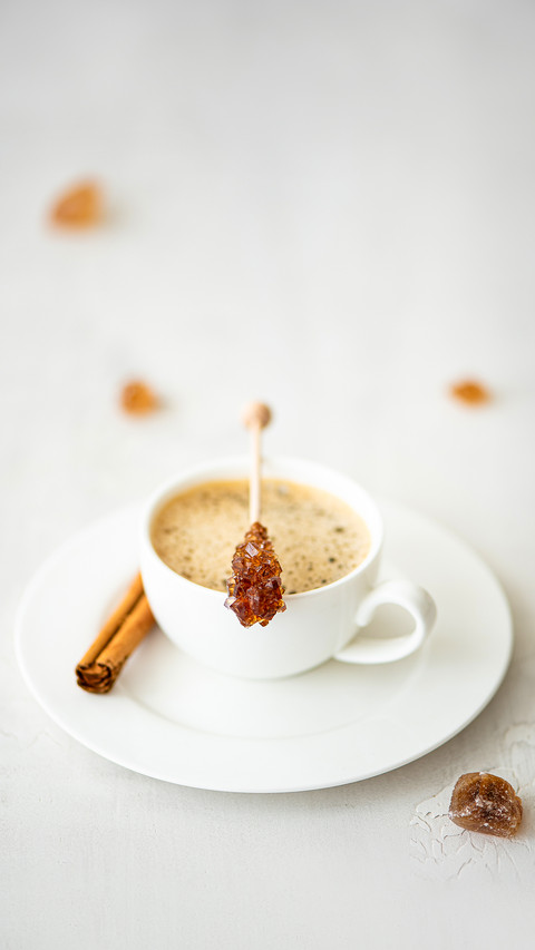 A cup of black coffee with cinnamon and caramelized sugar screenshot