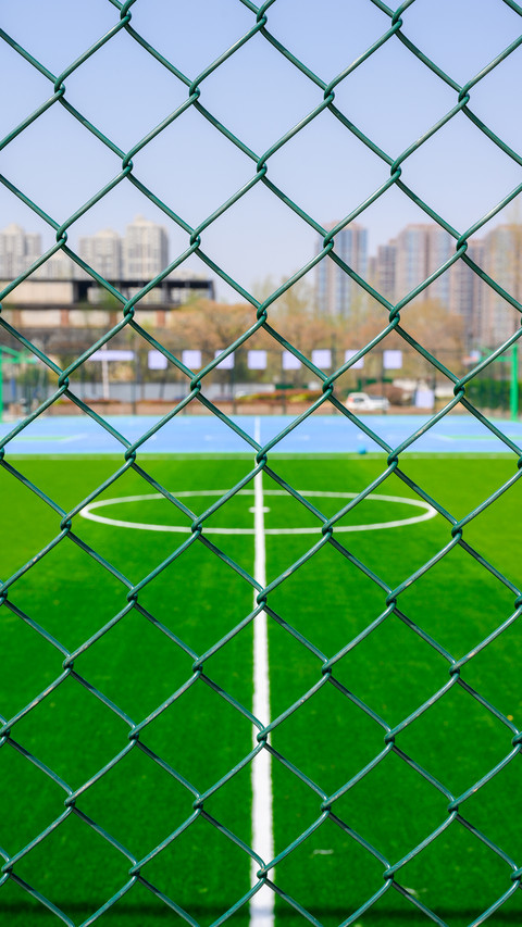 A bright and sunny urban community football field screenshot