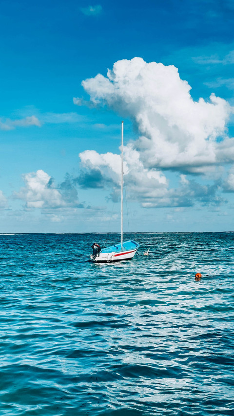 Boat ocean waves sky outdoor screenshot