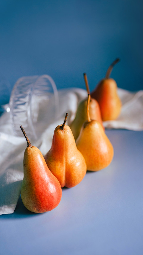 Juicy bright pears on a blue background screenshot