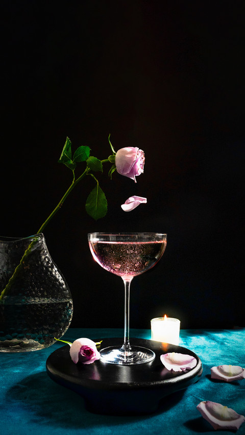 Champagne Cocktails with Pink Rose and a Candle screenshot