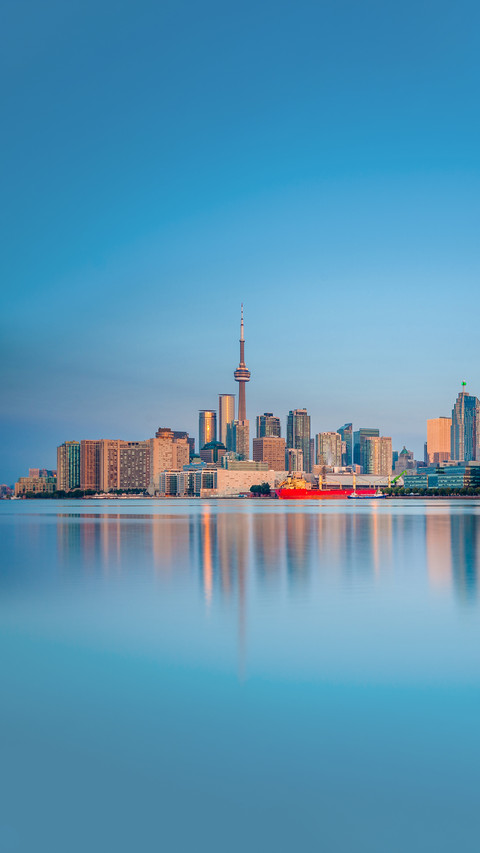 Skyline of Toronto over Ontario Lake at sunrise screenshot