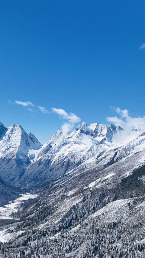 Snow capped mountains clouds reflecting the vast sky screenshot