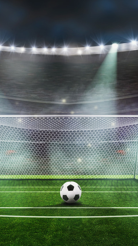 Ball on the green field at soccer stadium screenshot