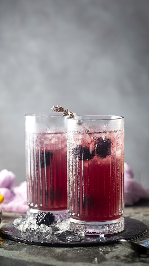 Refreshing Blackberry Lemonade in crystal glasses with ice screenshot