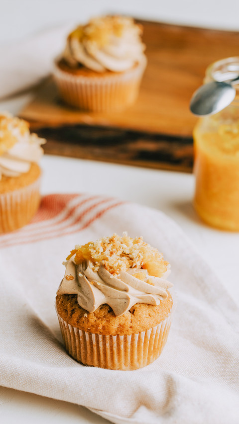 Yellow marmalade cupcakes on the rustic wooden table screenshot