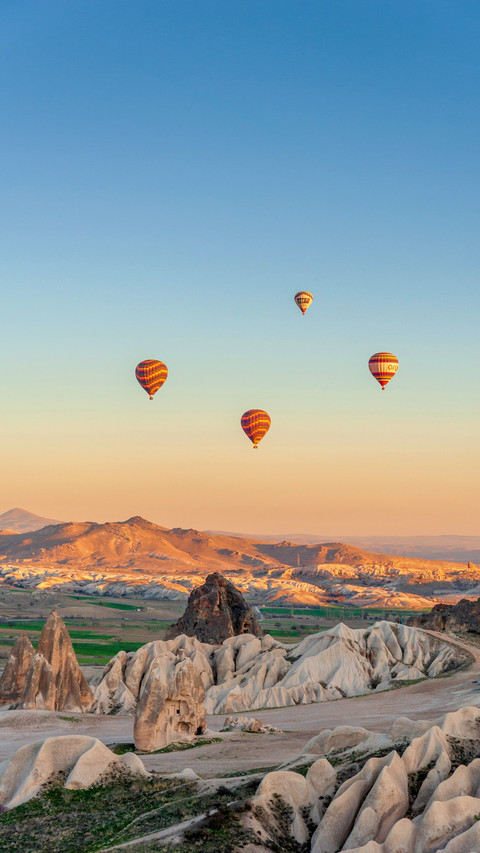 A hot air balloon floated over the cappadocia canyon screenshot