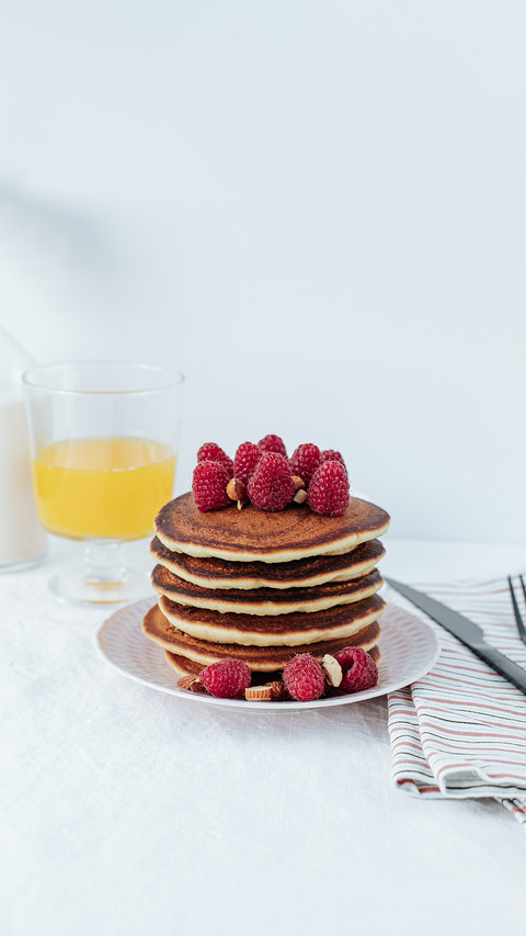 A stack of pancakes decorated with raspberries screenshot