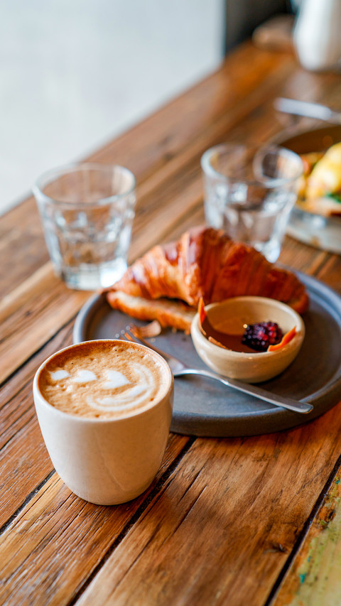 Top view of breakfast table with coffee and croissant screenshot