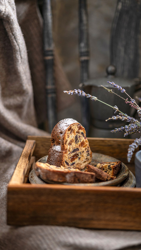A piece of a sponge or stollen cake with dried fruits screenshot