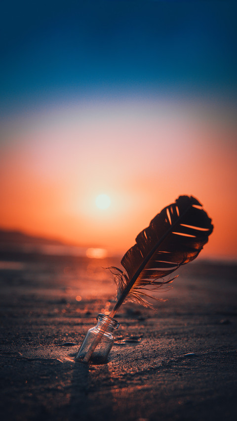 A majestic Sunset with a feather in an empty bottle screenshot