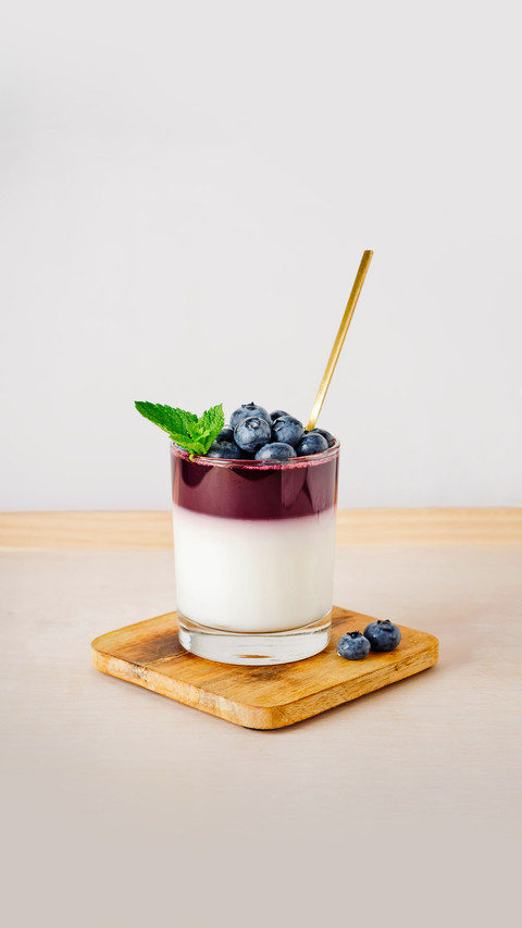 Yoghurt jelly with blueberries on a light background screenshot