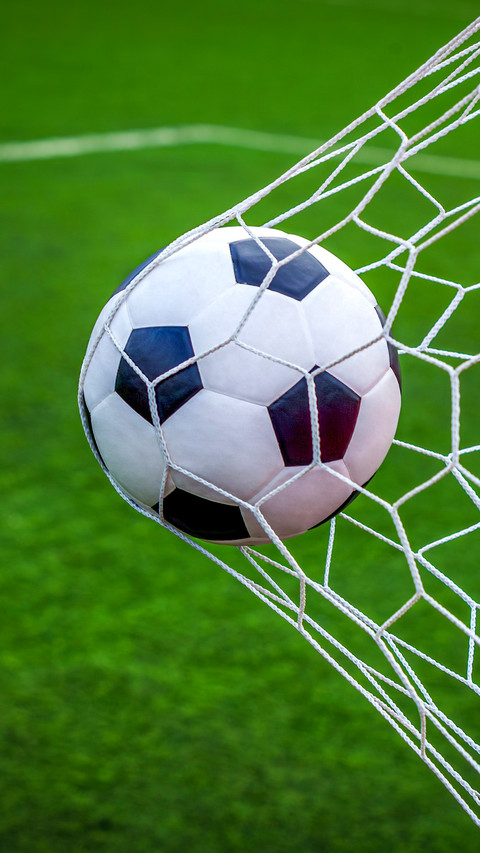 Soccer ball on goal with net background screenshot