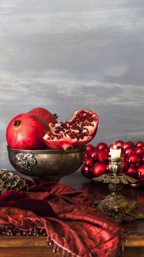 Pomegranates on a christmas table screenshot
