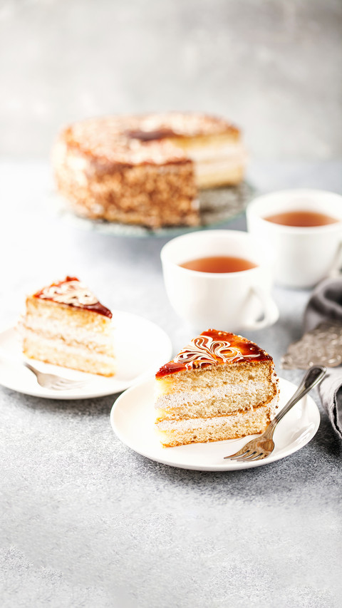 Cake with cream and a decor on a table screenshot