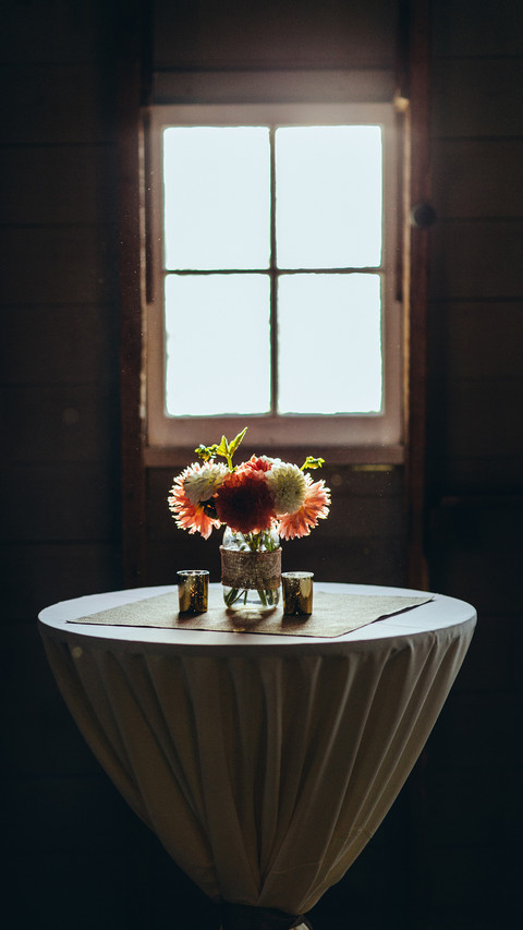Bouquet of flowers in a vase on the table by the window screenshot