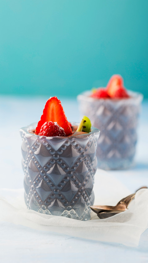 Glasses of mousse au chocolat garnished with raspberries screenshot