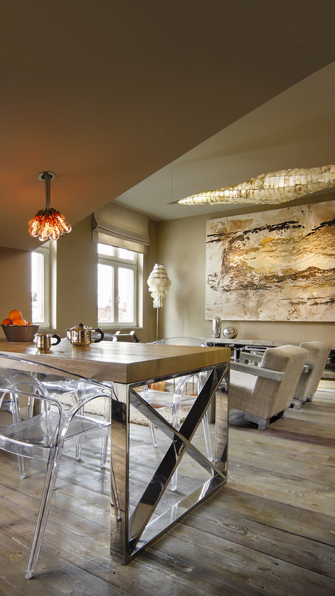 Transparent plastic chairs around table with chrome frame screenshot