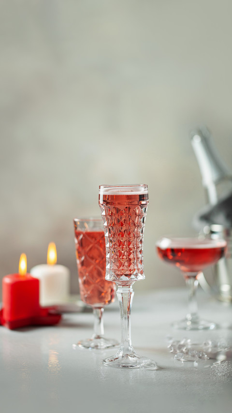 Glasses of champagne on grey background screenshot