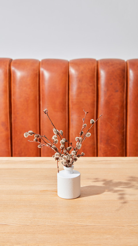 Dry flowers in a vase on a table in a room screenshot