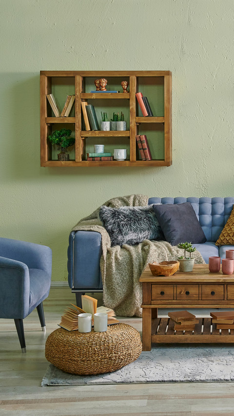 Living Room with Blue Sofa and Hanging Decorations screenshot