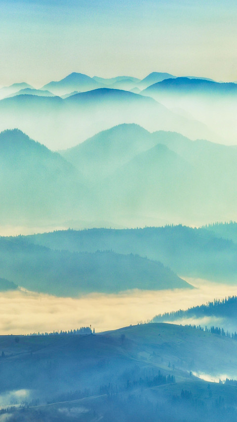 Clouds and mist surround the mountains screenshot