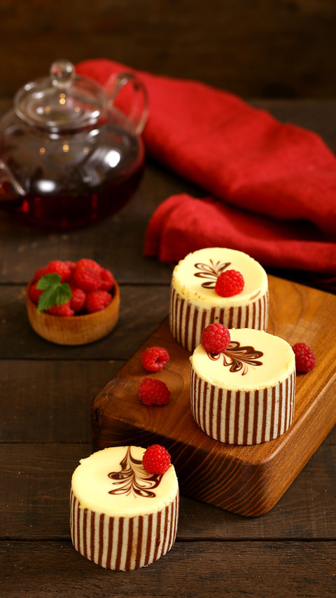 Three chocolate cake with fresh raspberries screenshot