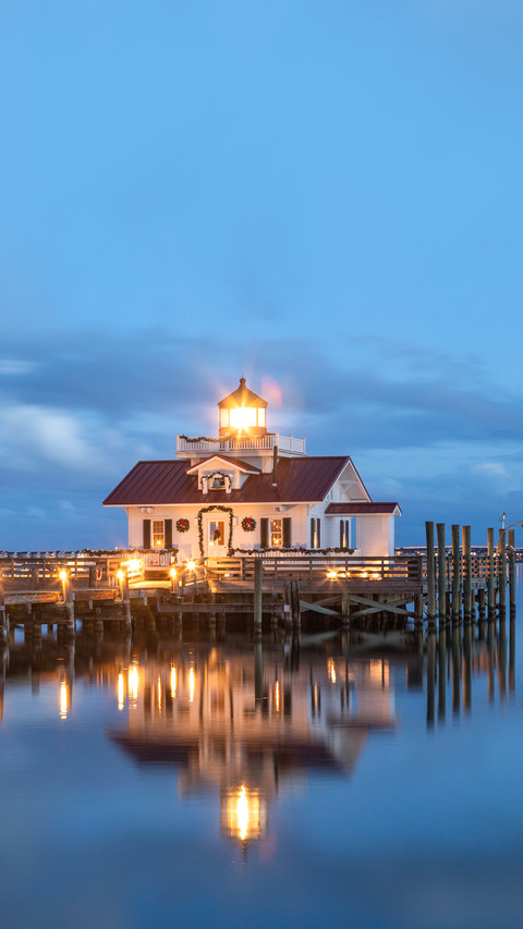 The Roanoke Marshes Lighthouse illuminated against the cloud screenshot