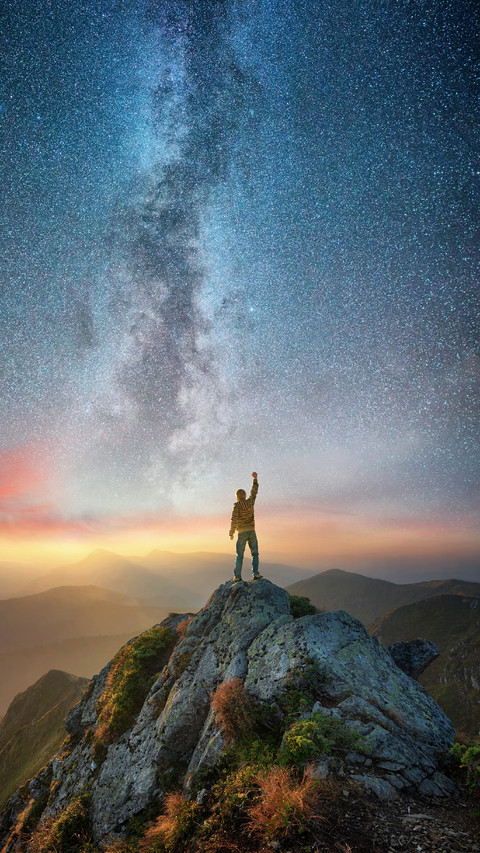 A Man Stands on The Top of The Mountain Under The Stars screenshot