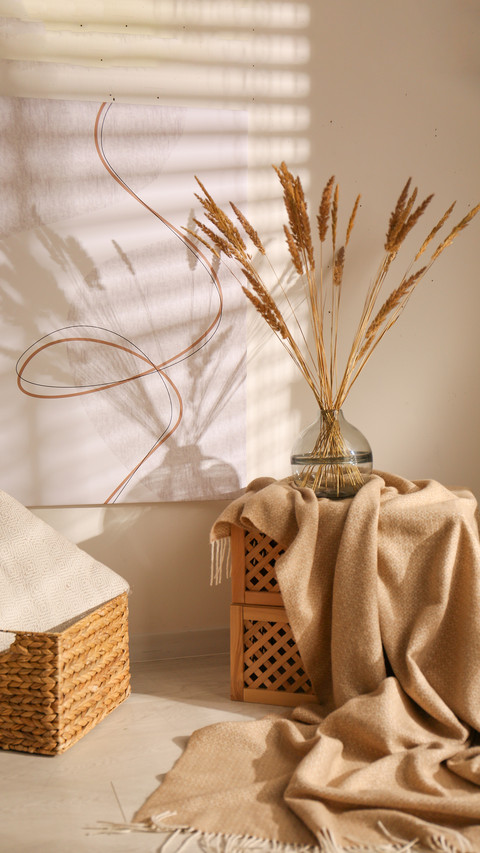 Vase with dried plants in a stylish room screenshot