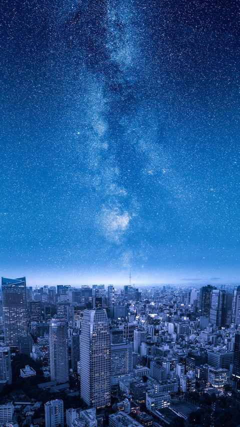 Stars of the Milky Way over Big City Skyline at Night screenshot