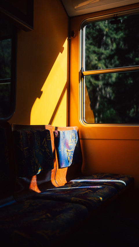 Empty train seat in yellow driving tram screenshot